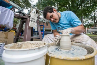 student doing ceramics