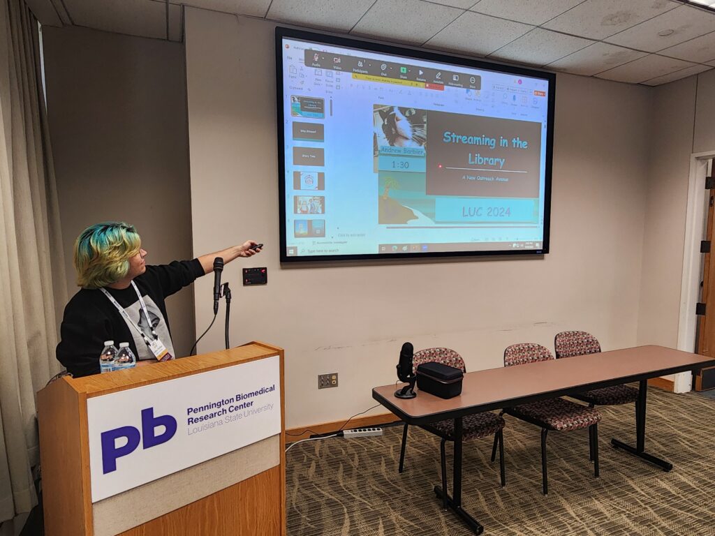 Librarian Andrew Barbier presents at LUC on streaming as a form of outreach, one of the aspects that helped him stand out as an early career librarian.