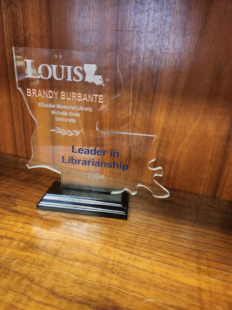 Director Brandy Burbante's leader in librarianship award.