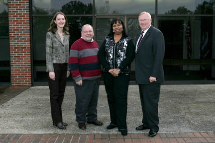 Pictured from left are Karen Powell, program director of Louisiana Campus Compact; Dr. Morris Coats, professor of economics, chair of the Service-Learning Committee at Nicholls and on-site supervisor of the VISTA program; Charlene Moore, AmeriCorps*VISTA volunteer; and Dr. Stephen T. Hulbert, university president.