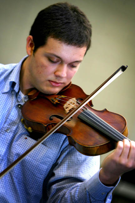Christiano Cruz wins Violin Division Competition Christiano Cruz, a sophomore violin major from João Pessoa, Brazil, practices for an upcoming national competition in Atlanta, Ga.