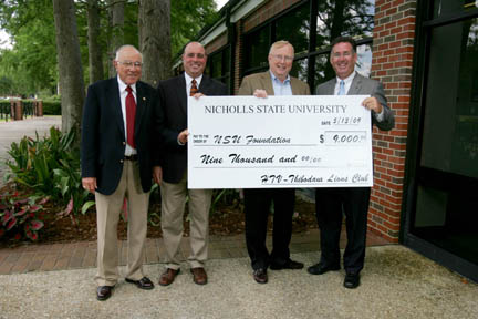 Representatives of the Thibodaux Lions Club and HTV-10 in Houma presented $9,000 in scholarship funds to the Nicholls State University Foundation on Wednesday, May 13. The funds were generated by the HTV/Lions Club Bayou vs. River Showdown – a charity football game conducted Saturday, Dec. 20, at John L. Guidry Stadium. Pictured from left are Luke Ford, co-chair of the football game; John Ford, director of human resources at Nicholls and co-chair of the game; Dr. Stephen T. Hulbert, university president; and Martin Folse, owner and president of HTV-10.