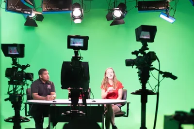 nicholls students in green room on camera